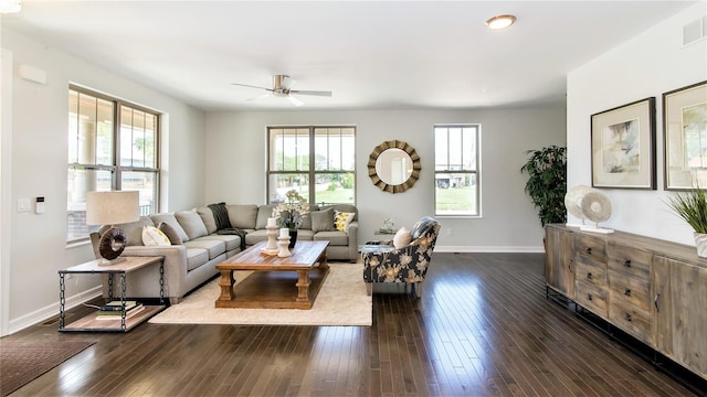 living room featuring ceiling fan and dark hardwood / wood-style flooring