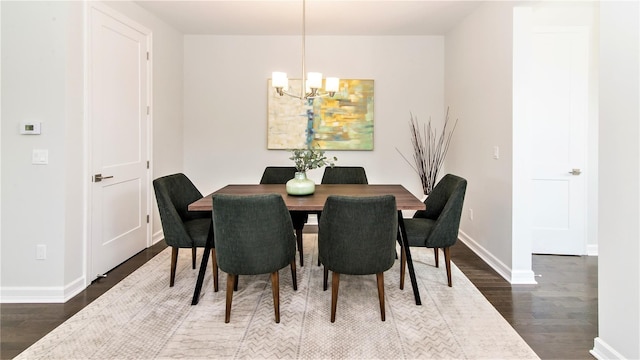 1361 W Canfield St, Detroit, MI 48208 - dining room featuring a chandelier, dark wood finished floors, and baseboards