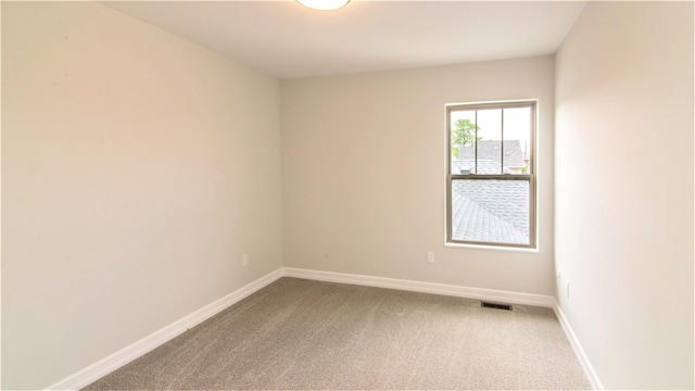 spare room featuring carpet flooring