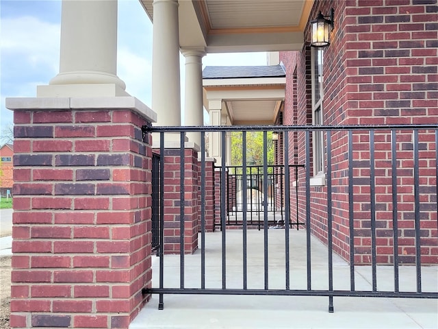 view of gate featuring covered porch