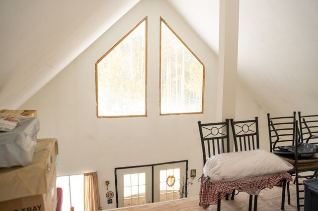 sitting room with lofted ceiling