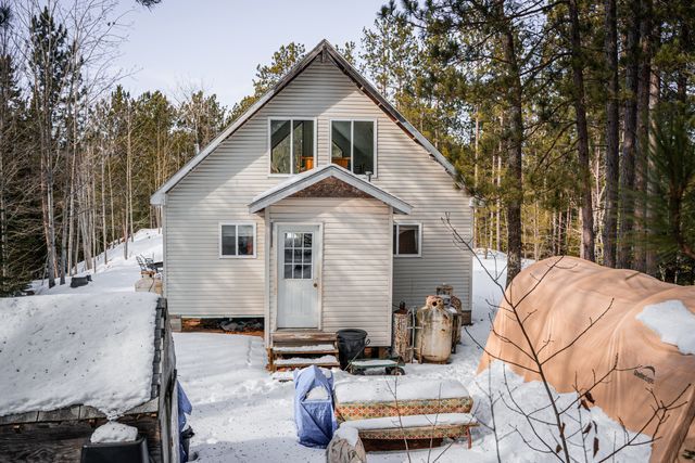 view of snow covered house