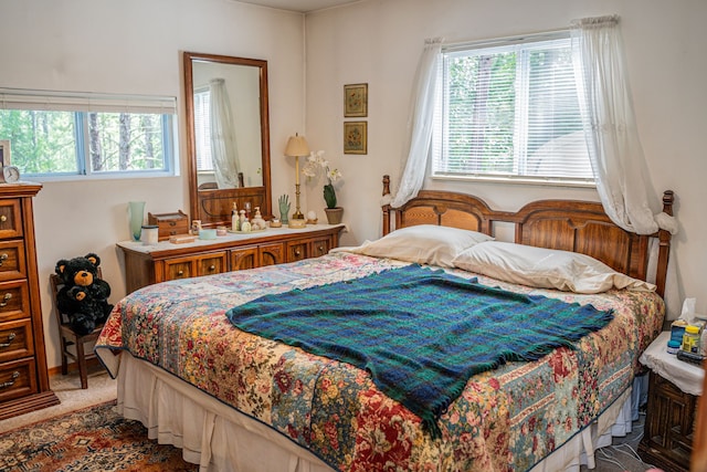 bedroom featuring carpet floors and multiple windows