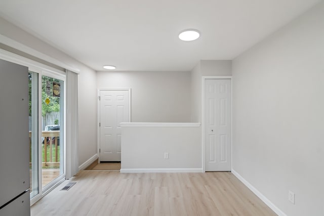 unfurnished room featuring light hardwood / wood-style flooring