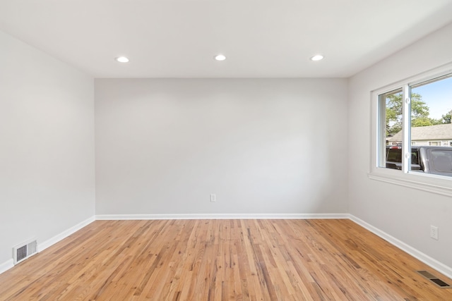 spare room featuring light wood-type flooring