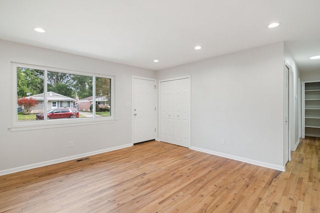 spare room with light hardwood / wood-style flooring