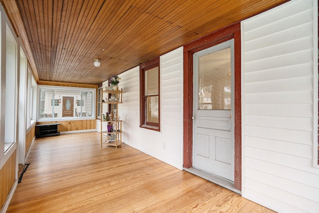 unfurnished sunroom featuring wood ceiling