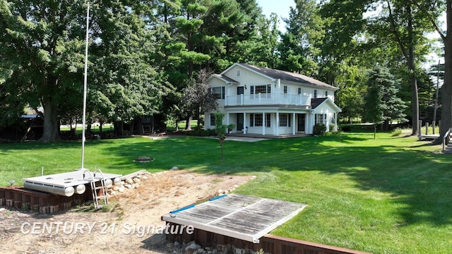 view of yard with a balcony