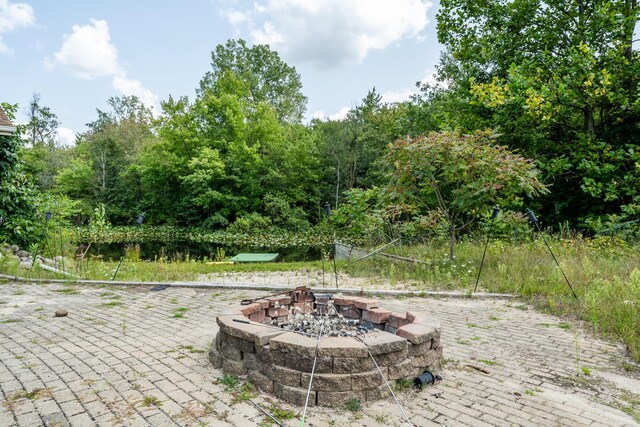 5419 N Watervliet Rd, Watervliet, MI 49098 - view of patio / terrace featuring an outdoor fire pit