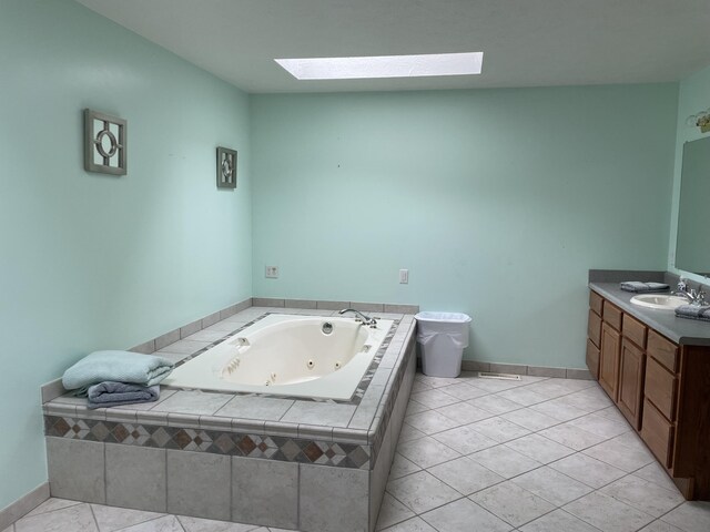 5419 N Watervliet Rd, Watervliet, MI 49098 - full bath featuring a skylight, vanity, a whirlpool tub, and baseboards