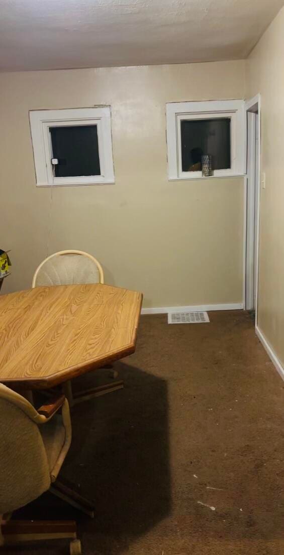 view of carpeted dining area