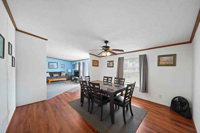 dining room with ceiling fan, dark hardwood / wood-style flooring, ornamental molding, and a textured ceiling