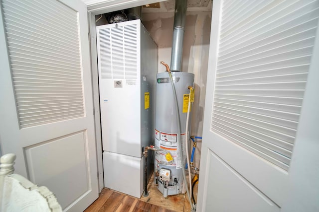 utility room featuring gas water heater