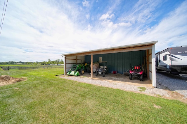 exterior space featuring a yard and a rural view