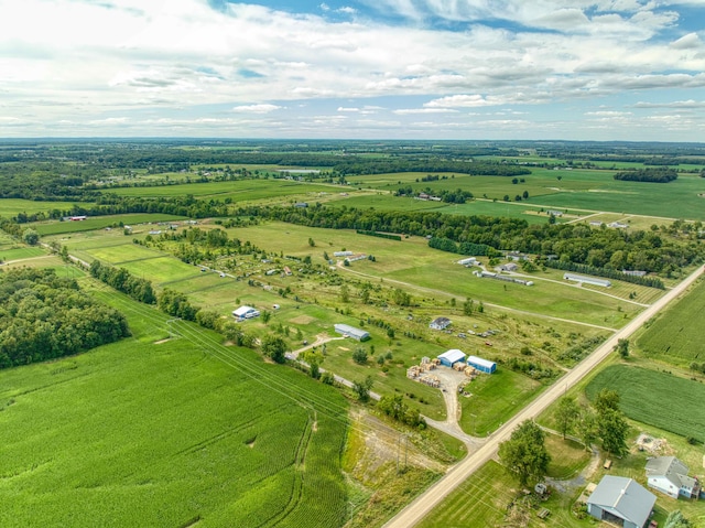 birds eye view of property featuring a rural view