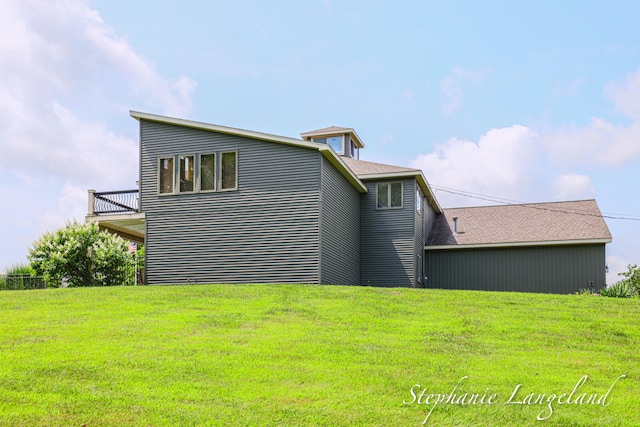 back of property with a lawn