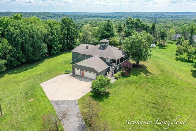 7300 Packer Dr NE, Belmont, MI 49306 - aerial view of property and surrounding area with a heavily wooded area
