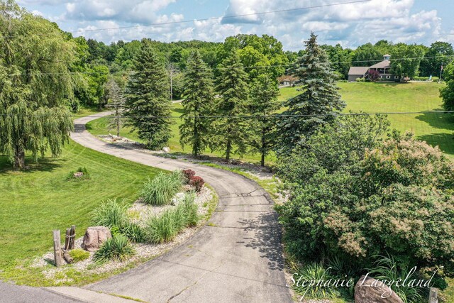 7300 Packer Dr NE, Belmont, MI 49306 - view of home's community with a lawn