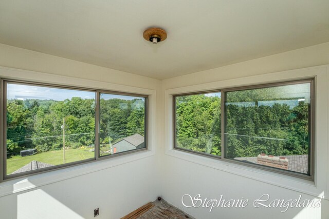 7300 Packer Dr NE, Belmont, MI 49306 - unfurnished sunroom featuring healthy amount of natural light
