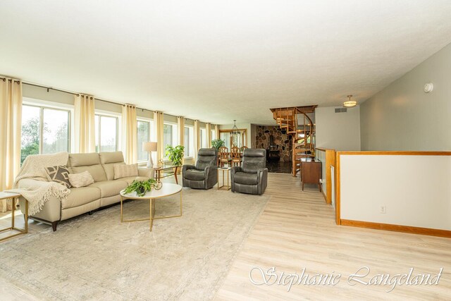 7300 Packer Dr NE, Belmont, MI 49306 - living area with light wood-type flooring and baseboards