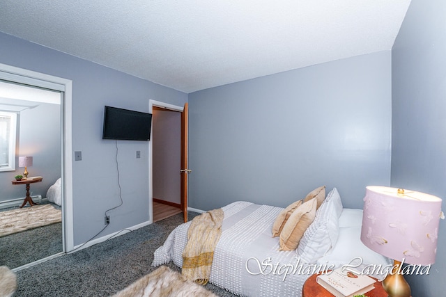 carpeted bedroom with a textured ceiling