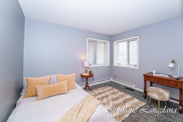 carpeted bedroom with a baseboard radiator