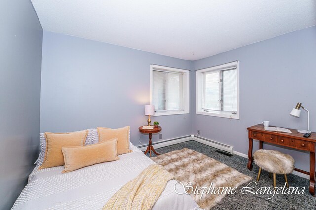7300 Packer Dr NE, Belmont, MI 49306 - carpeted bedroom with baseboards and a baseboard radiator