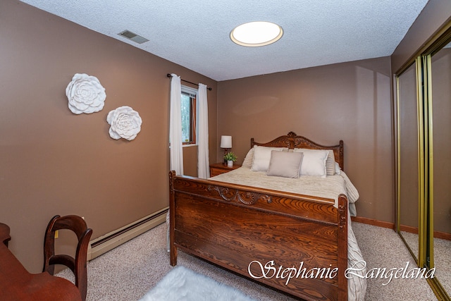 carpeted bedroom featuring a textured ceiling and a baseboard radiator