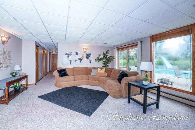 7300 Packer Dr NE, Belmont, MI 49306 - living area featuring carpet and a paneled ceiling
