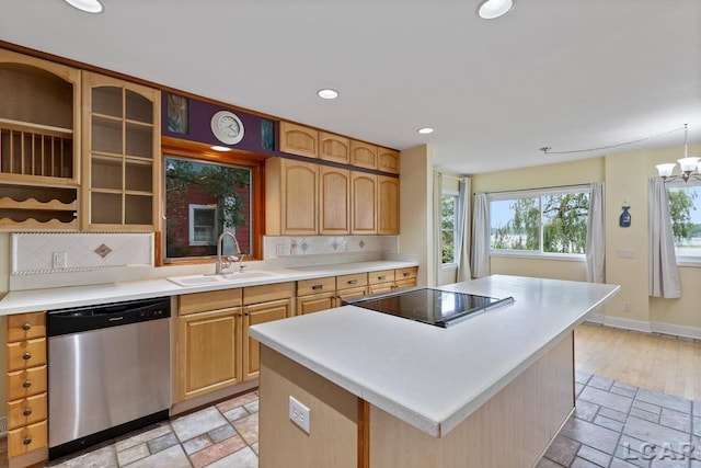 kitchen with dishwasher, sink, decorative backsplash, black electric stovetop, and a kitchen island