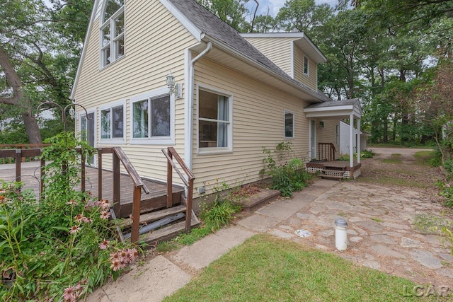 view of property exterior with a patio