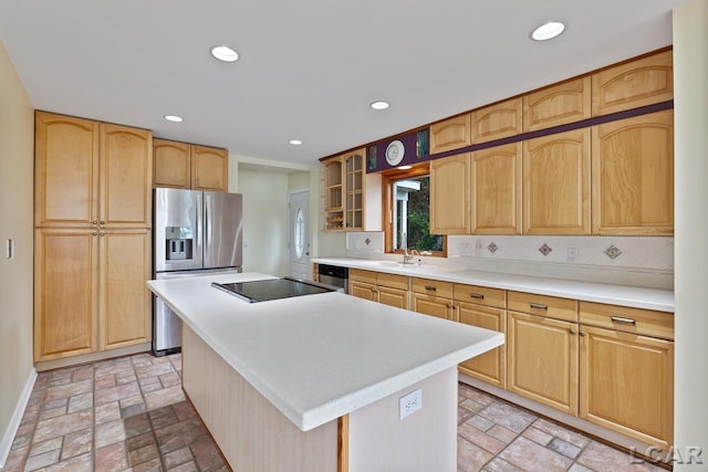 kitchen with backsplash, a center island, stainless steel appliances, and sink