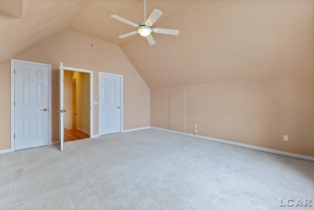 additional living space featuring light carpet, vaulted ceiling, and ceiling fan