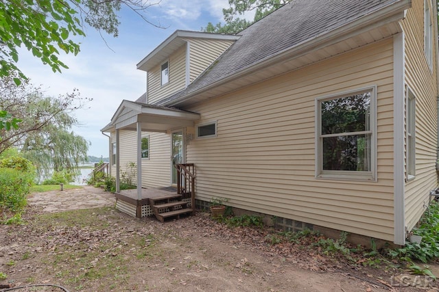 view of property exterior featuring a wooden deck