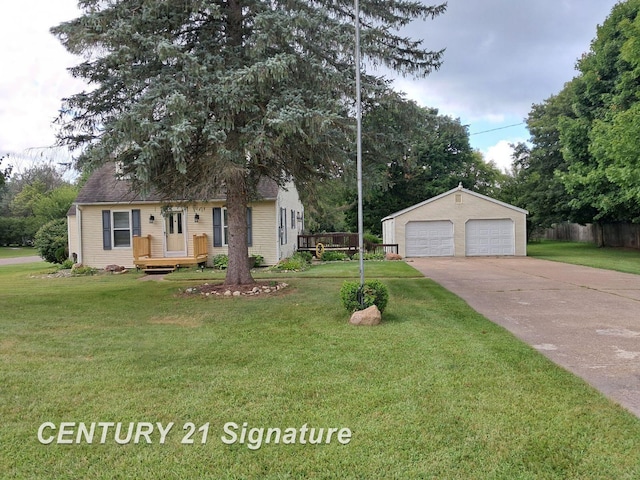 view of front of property featuring a garage, an outdoor structure, and a front lawn