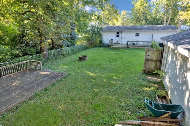 view of yard with a wooden deck