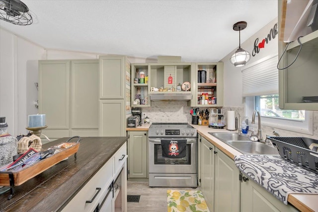 kitchen with exhaust hood, electric stove, sink, butcher block countertops, and decorative light fixtures