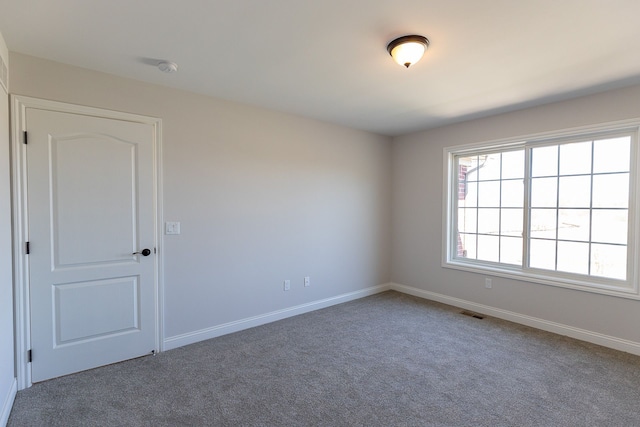 unfurnished room with carpet