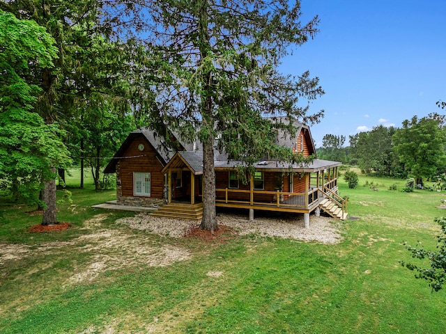 back of house with a lawn