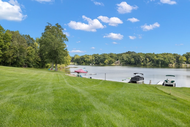 exterior space featuring a water view and a boat dock