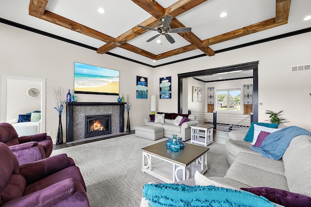 living room with ceiling fan, beam ceiling, light carpet, and coffered ceiling