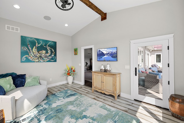 living room with beam ceiling, high vaulted ceiling, and light hardwood / wood-style floors