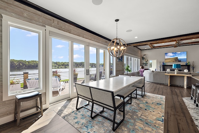 dining area with wood-type flooring and plenty of natural light