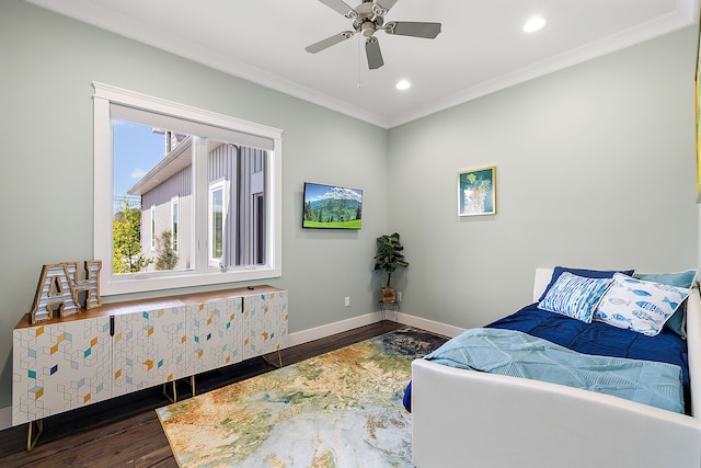 bedroom with ceiling fan, crown molding, and dark wood-type flooring