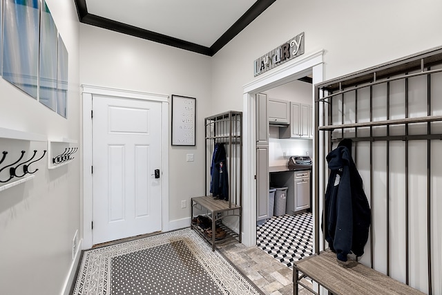 mudroom featuring crown molding