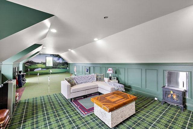 living room featuring dark carpet and vaulted ceiling