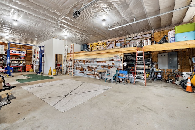 garage with a workshop area and a garage door opener