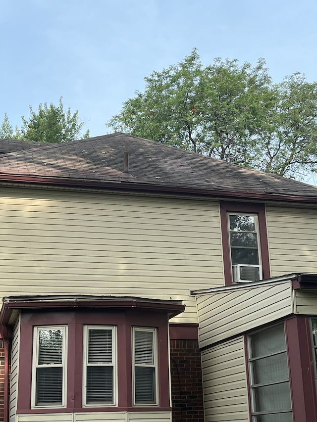 view of home's exterior with cooling unit