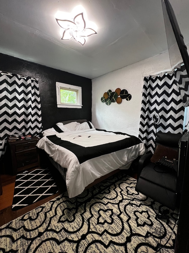 bedroom featuring hardwood / wood-style flooring