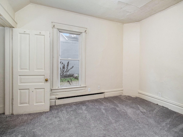 carpeted empty room featuring vaulted ceiling and ornamental molding